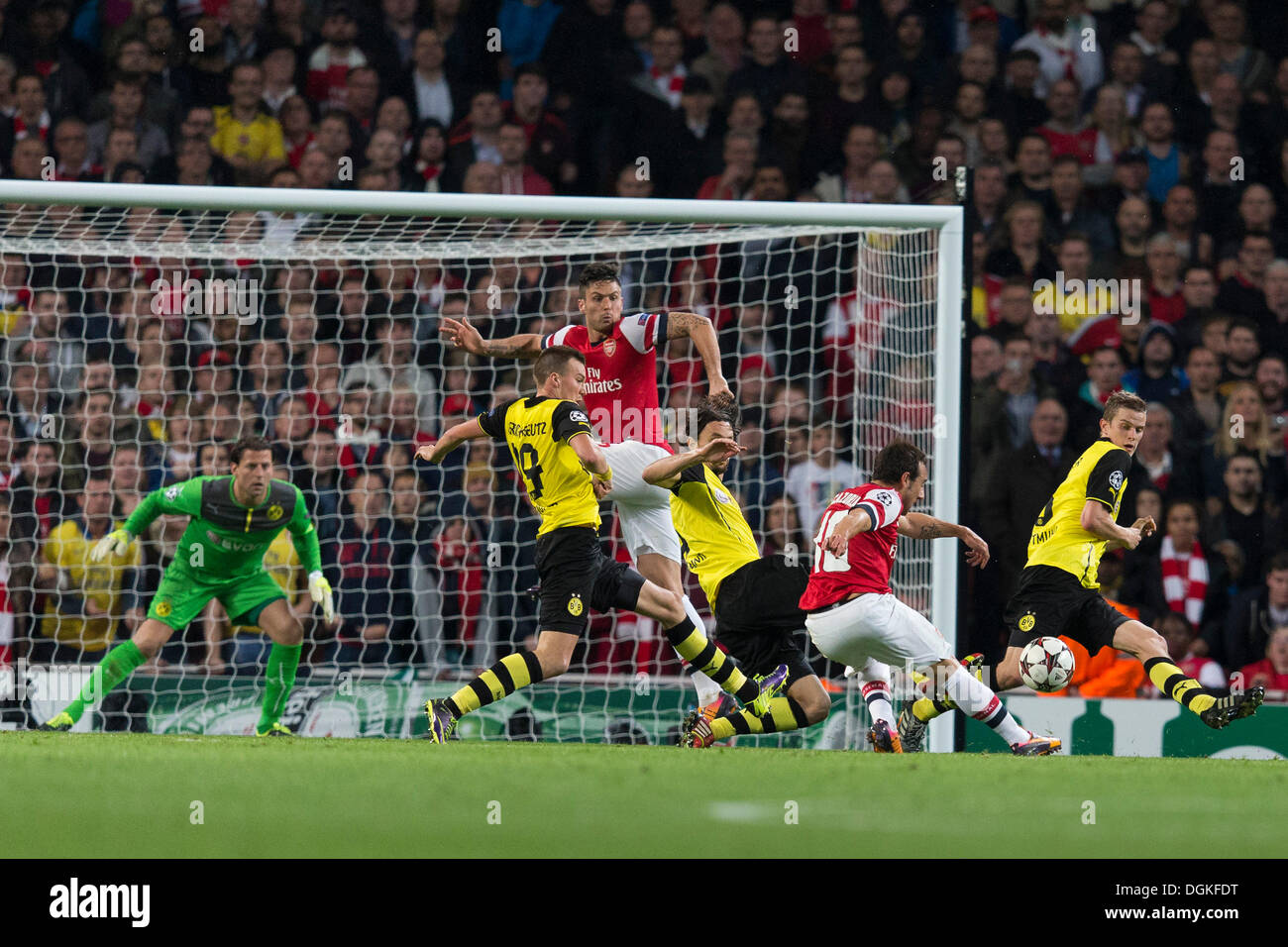 London, UK. 22nd Oct, 2013. Arsenal midfielder Santi CAZORLA gets a shot away under pressure during the Champions League game between Arsenal and Borussia Dortmund from the Emirates Stadium. © Action Plus Sports/Alamy Live News Stock Photo