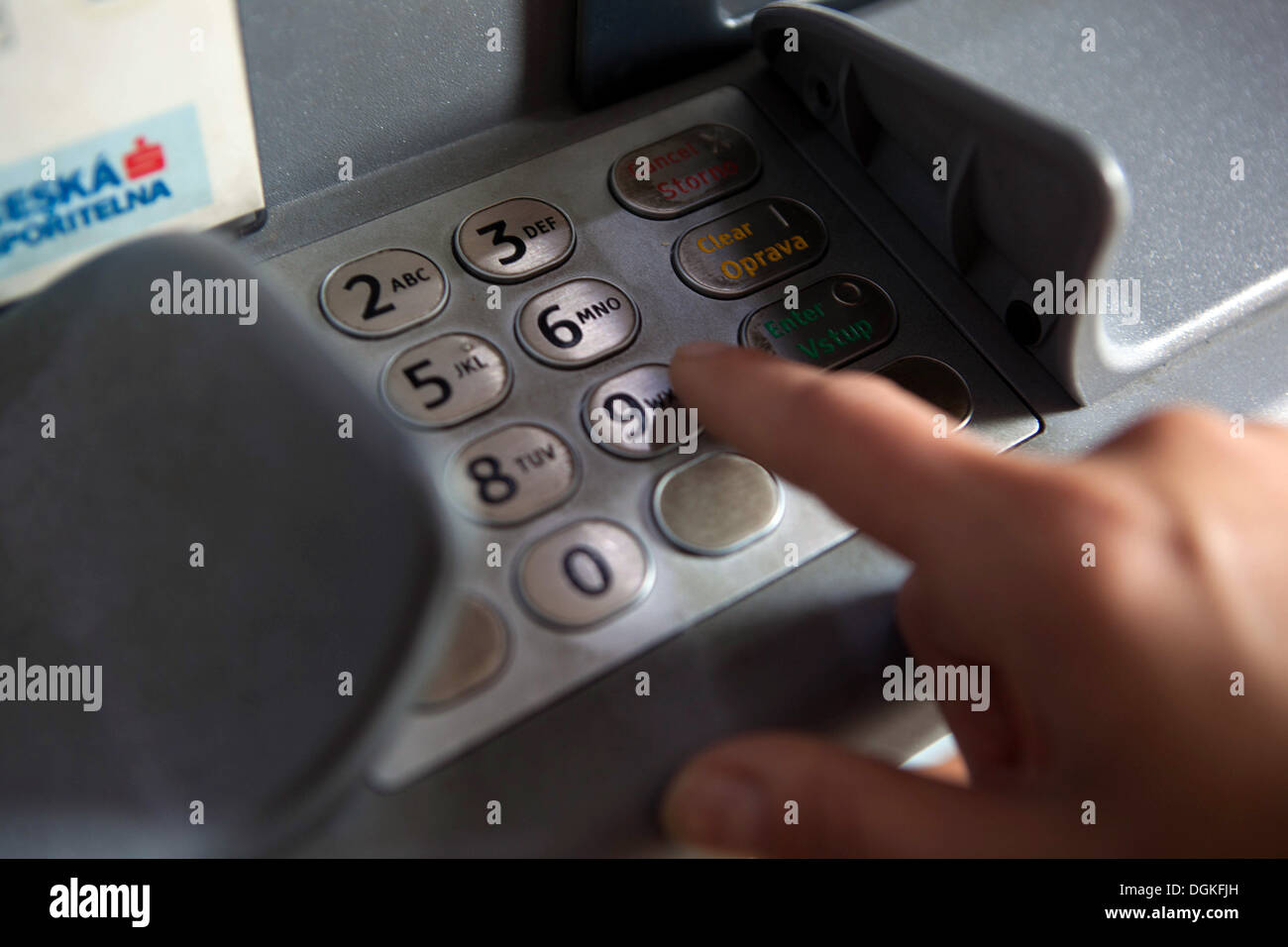 Insert PIN Code, Finger pressing password number on ATM machine Stock Photo