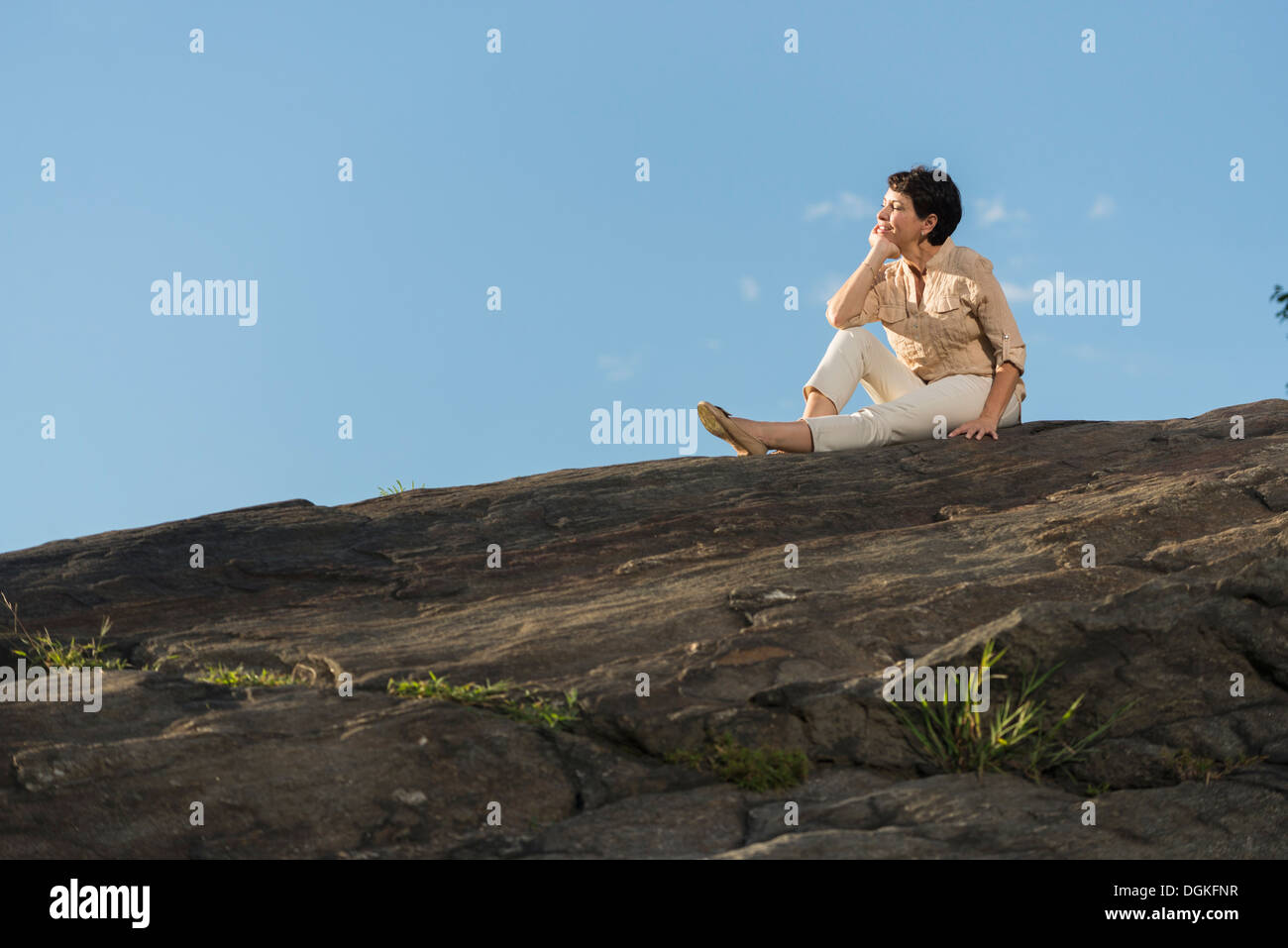 Mature beautiful woman sitting hi-res stock photography and images - Alamy