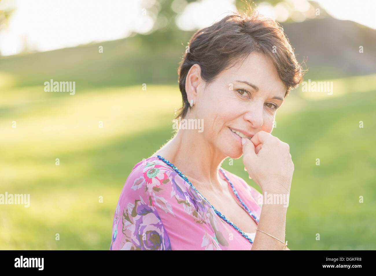 Portrait of mature woman smiling outdoors Stock Photo - Alamy