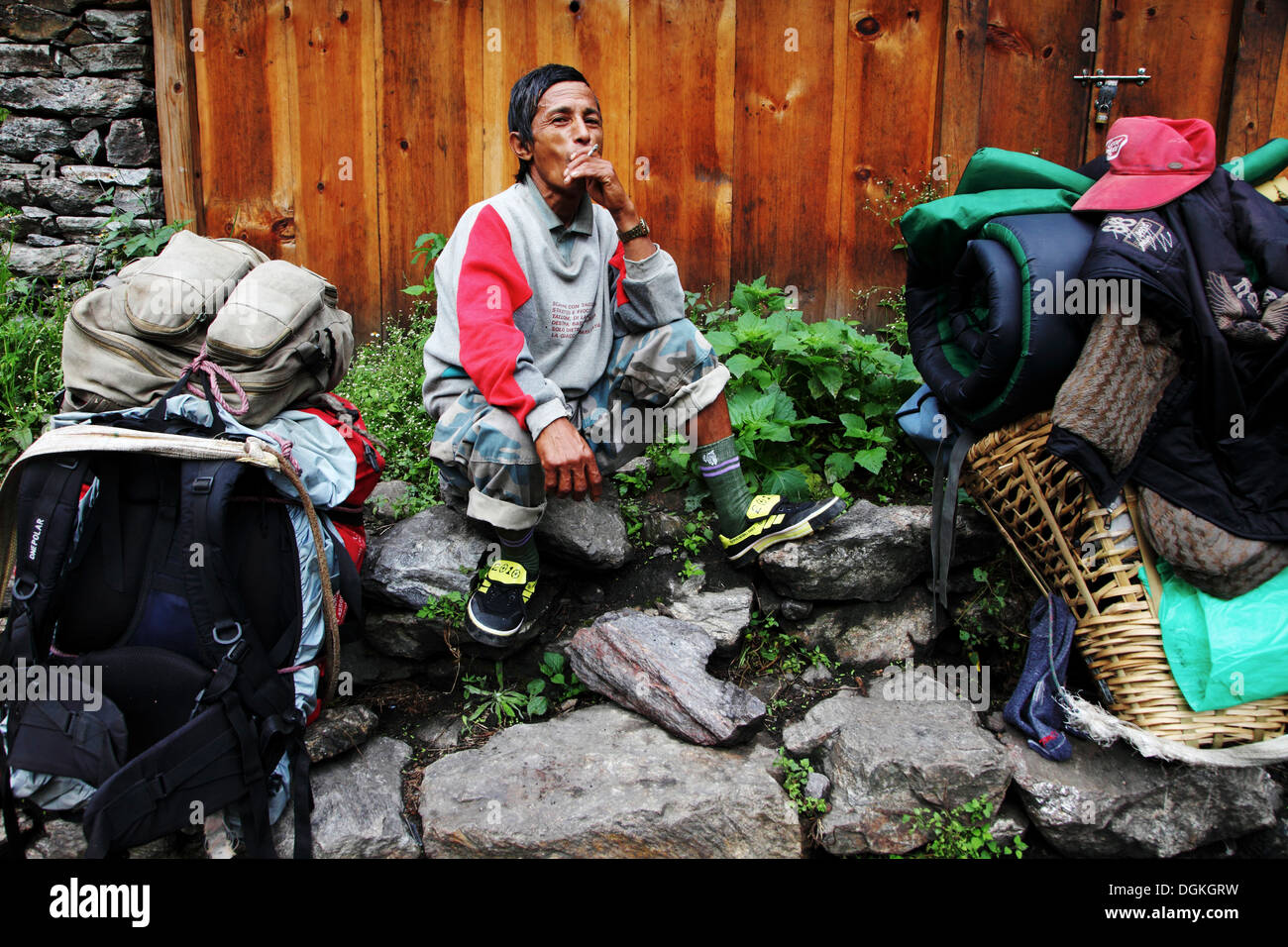 A porter smoking a cigarette Stock Photo - Alamy