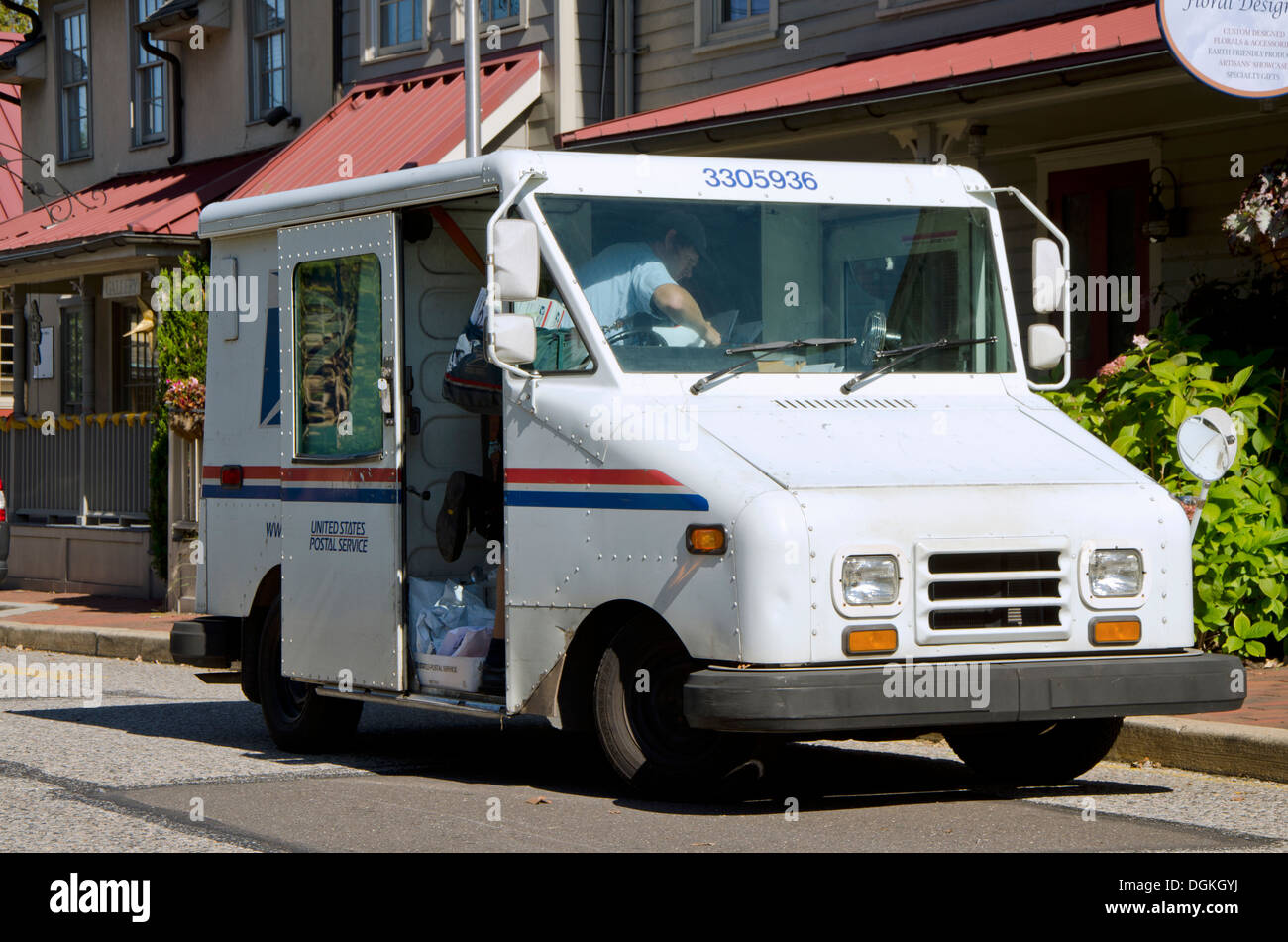 Electric US Postal Service Truck delivering. United States. Stock Photo