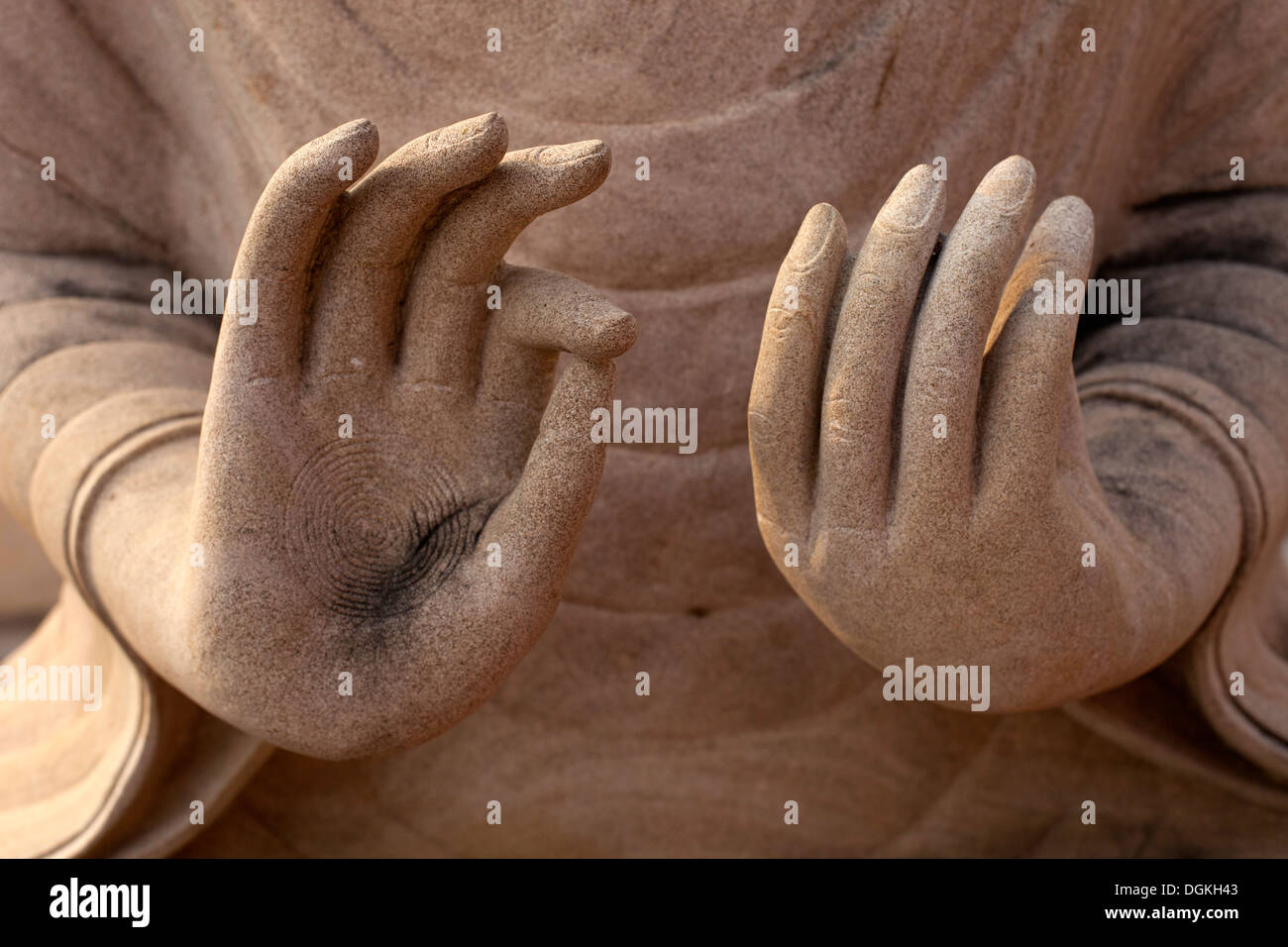 Details of a Buddha statue's hands in a temple in a village near Battambang, Cambodia. Photos © Dennis Drenner 2013. Stock Photo