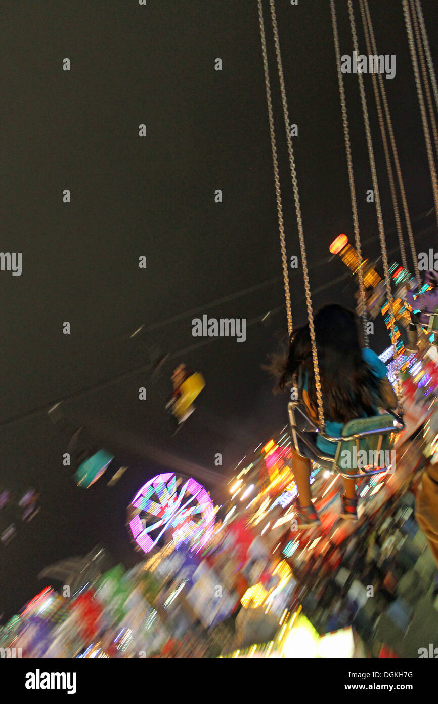 Swings ride at the state fair Stock Photo Alamy