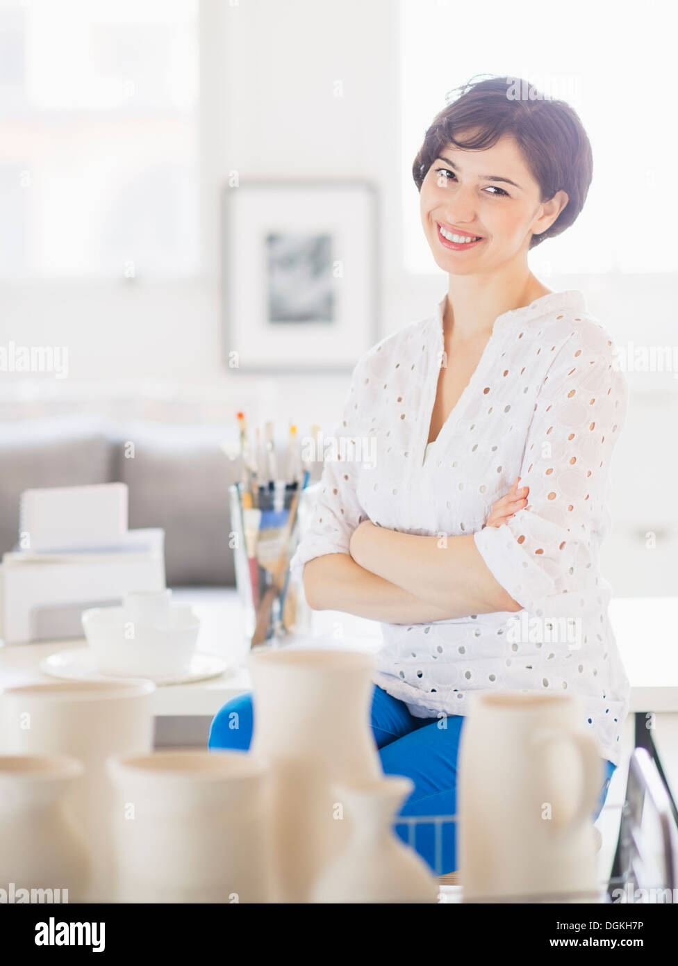Portrait of smiling woman in art studio Stock Photo