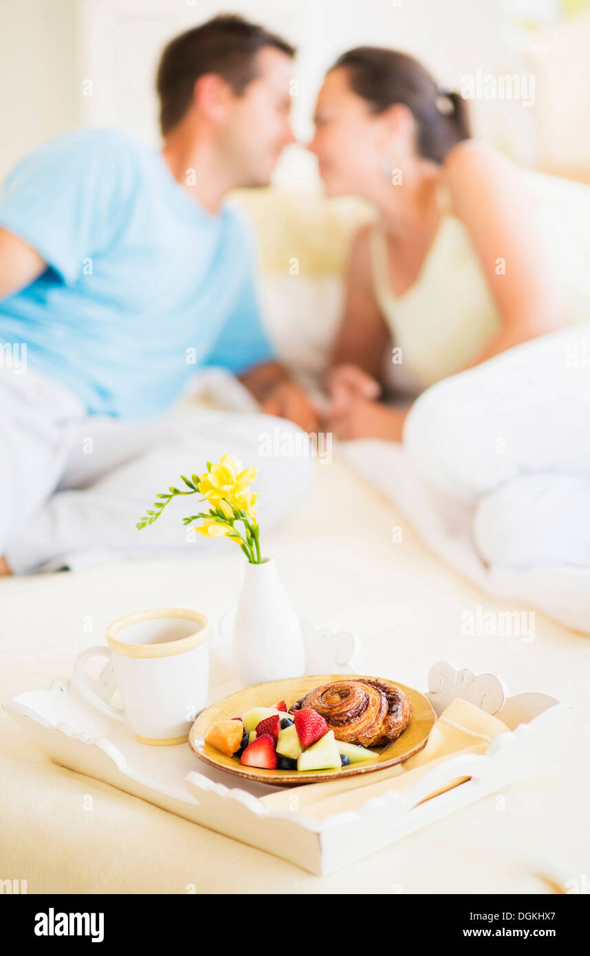 Woman and man having breakfast in bed Stock Photo