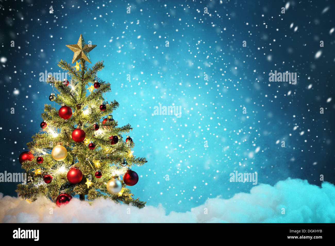Decorated Christmas tree in snowy night,Concept. Stock Photo