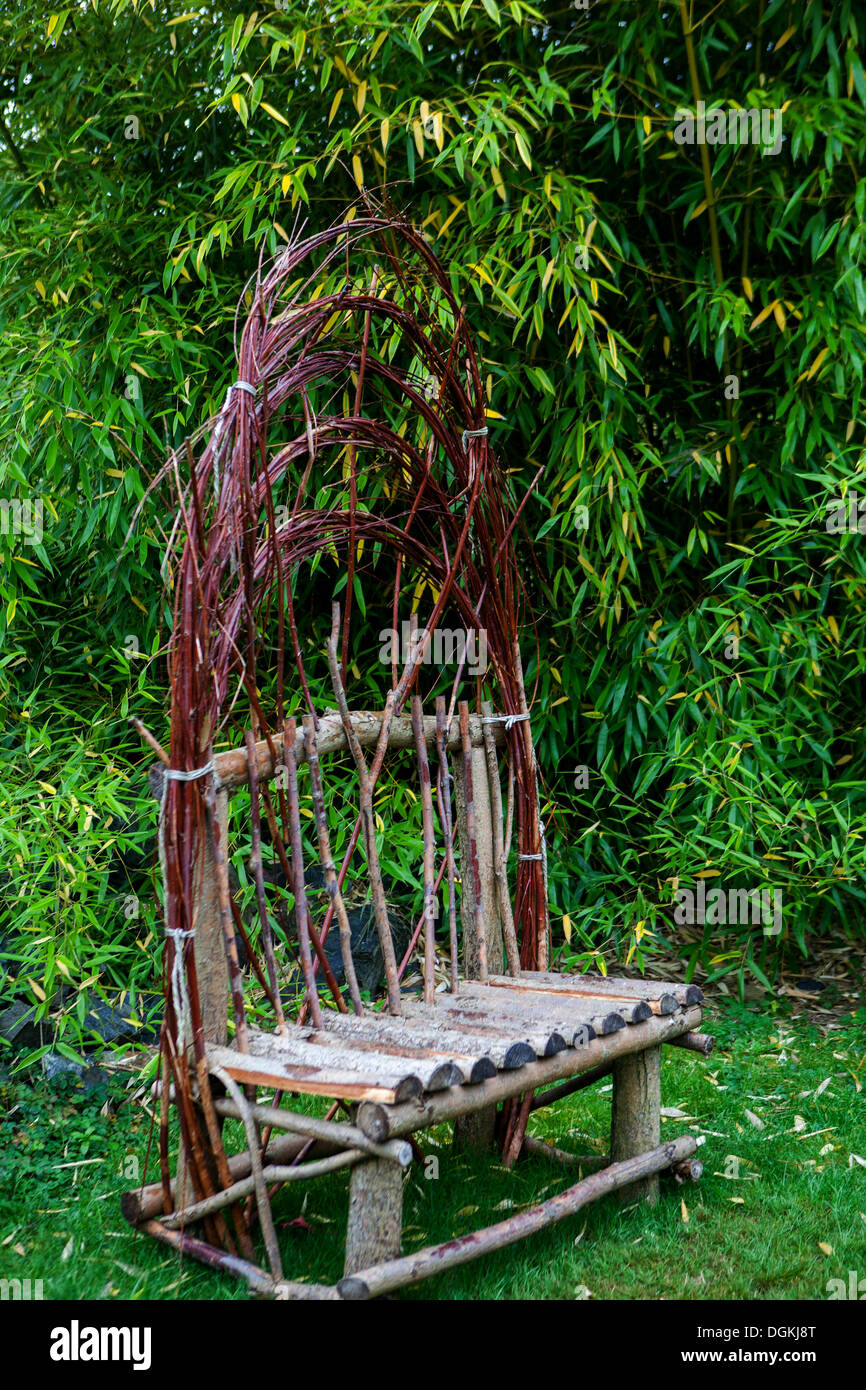 Garden Wicker Bench under Bamboo Stock Photo