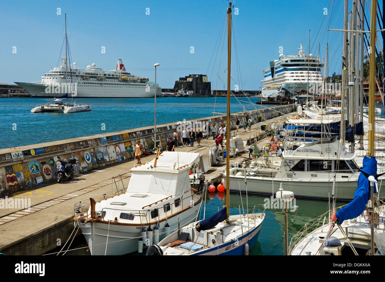 Boats and cruise ships dock in Funchal marina and harbour. Stock Photo
