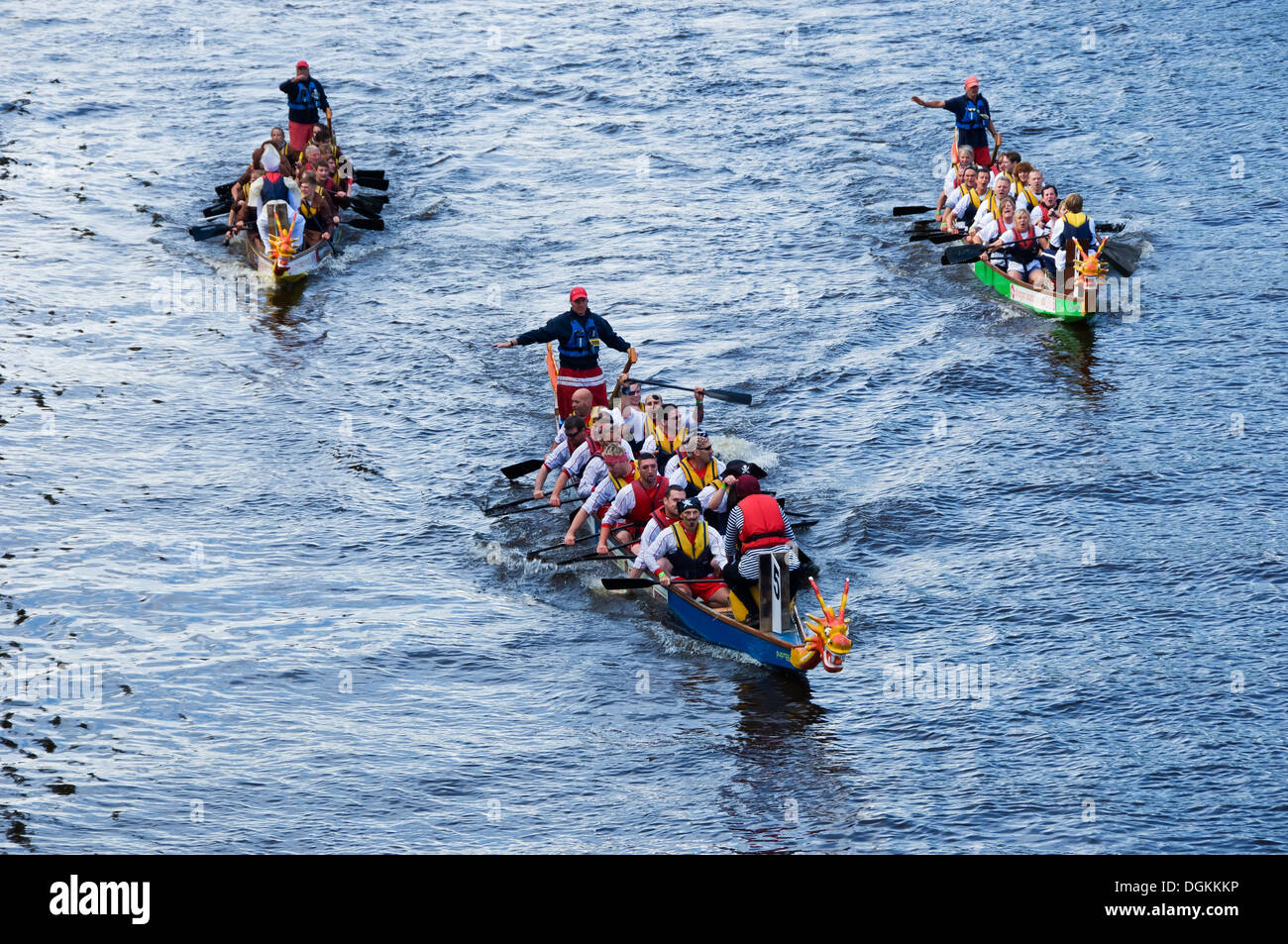 Boats crossing the finishing line at the Dragon Boat Challenge on the River Ouse. Stock Photo