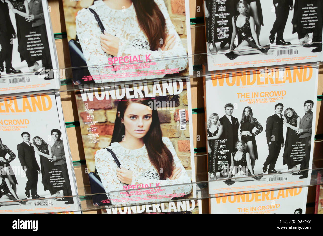 Copies of Wonderland magazine in a shop window. Stock Photo