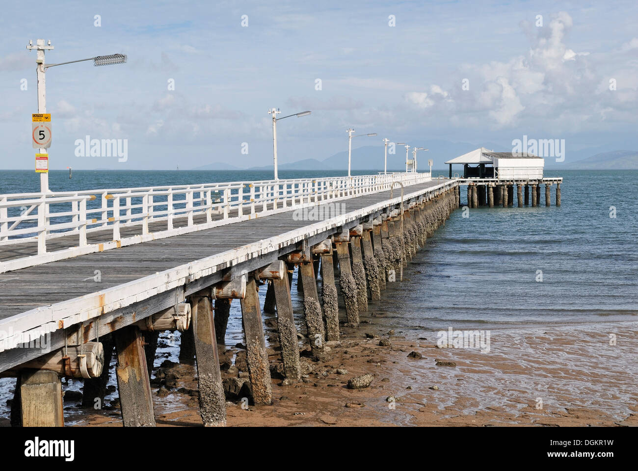 Old jetty at low tide, wooden construction, Picnic Bay, Magnetic Island, Queensland, Australia Stock Photo