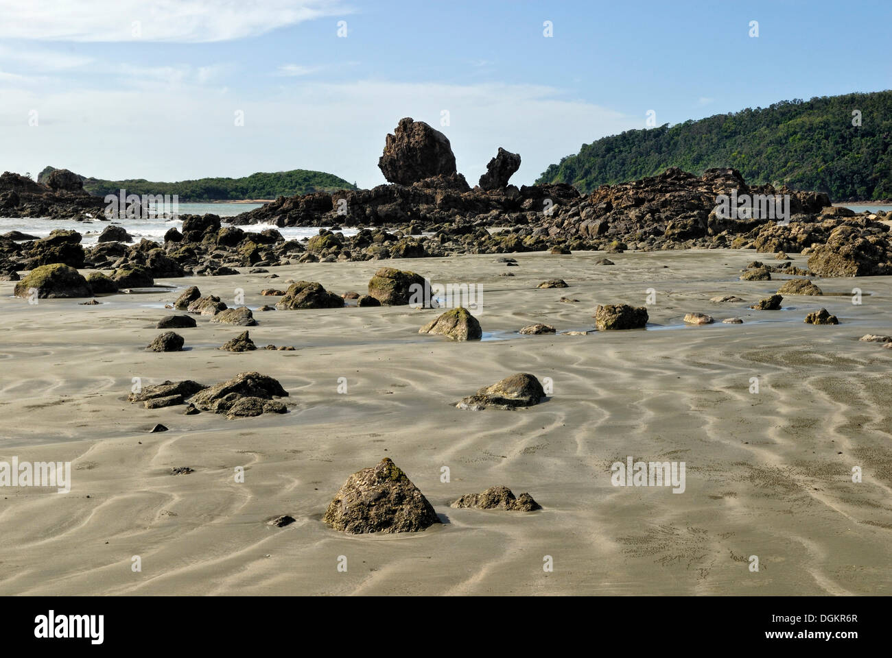 Sandy beach with volcanic rocks, Cape Hillsborough National Park near Mackay, Queensland, Australia Stock Photo