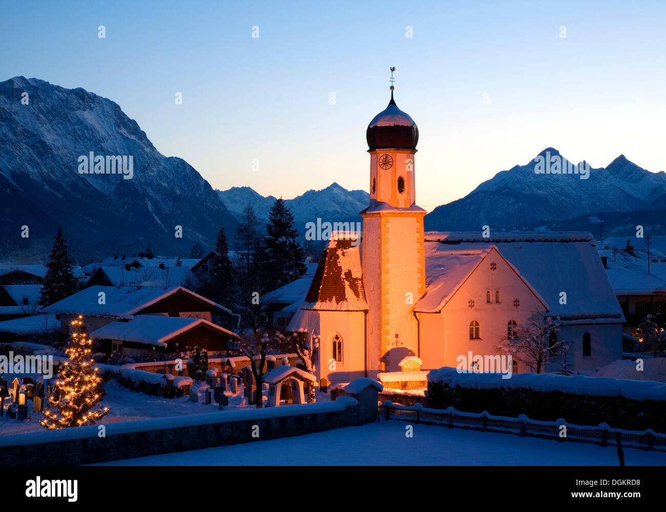 Snow-covered church with Christmas lighting near Wallgau, Upper Bavaria, Bavaria Stock Photo