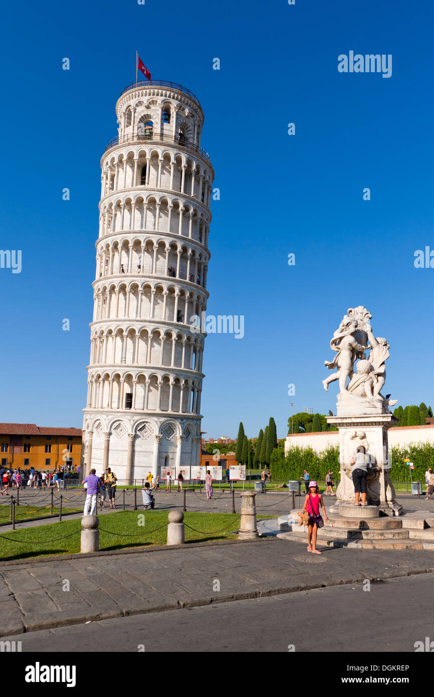 Fontana dei Putti and Leaning Tower of Pisa at Piazza dei Miracoli in Pisa. Stock Photo