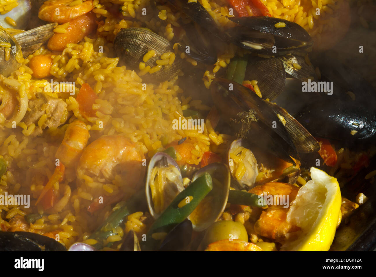 Closeup view of a pan of paella cooking at a seafood festival in Santa