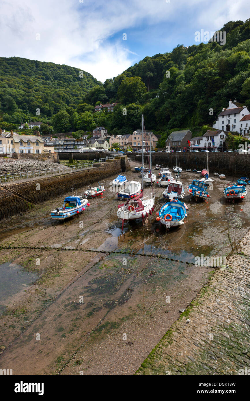 Small boats in Lynmouth Harbour at low tide in Exmoor National Park. Stock Photo