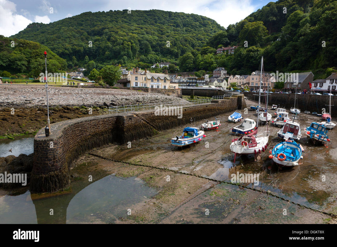Small boats in Lynmouth Harbour at low tide at Exmoor National Park. Stock Photo