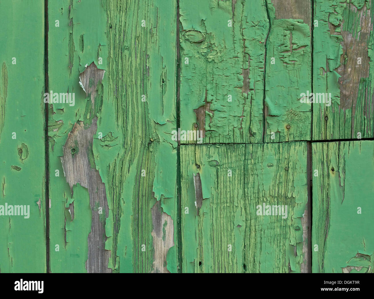 Weathered wooden wall with green paint, background Stock Photo