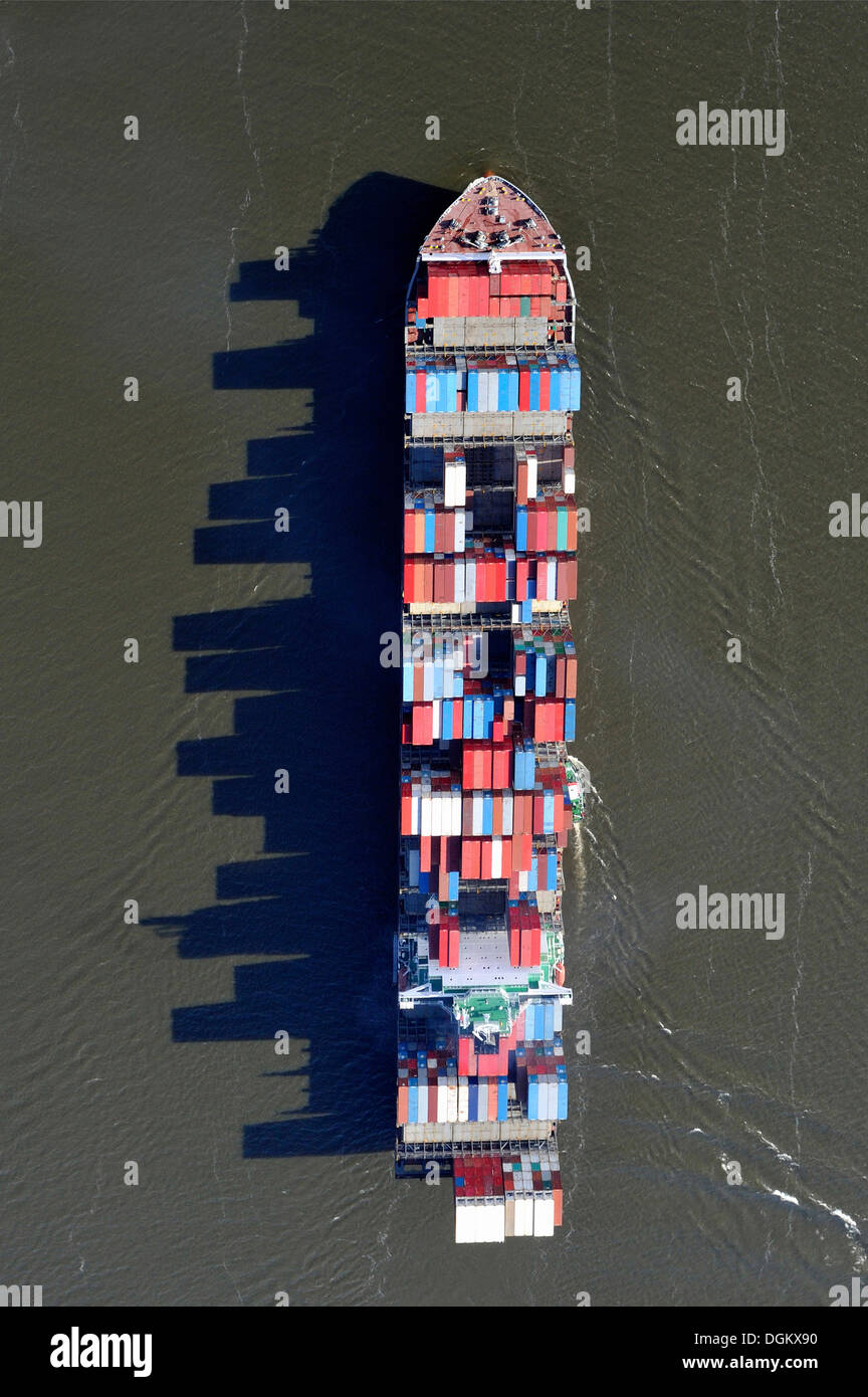 Aerial view, container ship on the Elbe River, with long shadows of the stacked containers, Hamburg, Hamburg, Germany Stock Photo