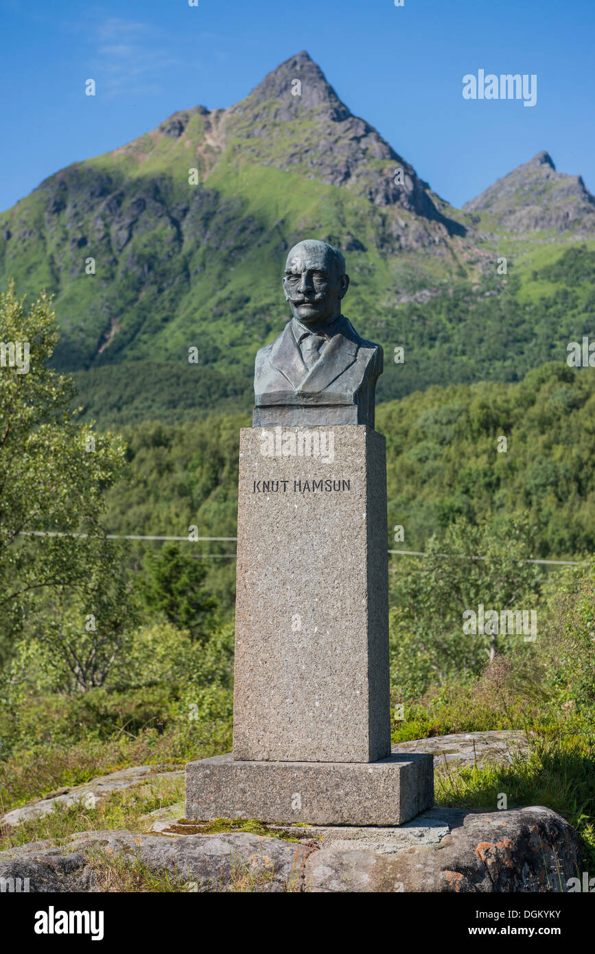 Monument for Knut Hamsun, bronze bust on a stone plinth, in front of a mountain landscape, Ortsteil Hamsund, Kommune Hamarøy Stock Photo