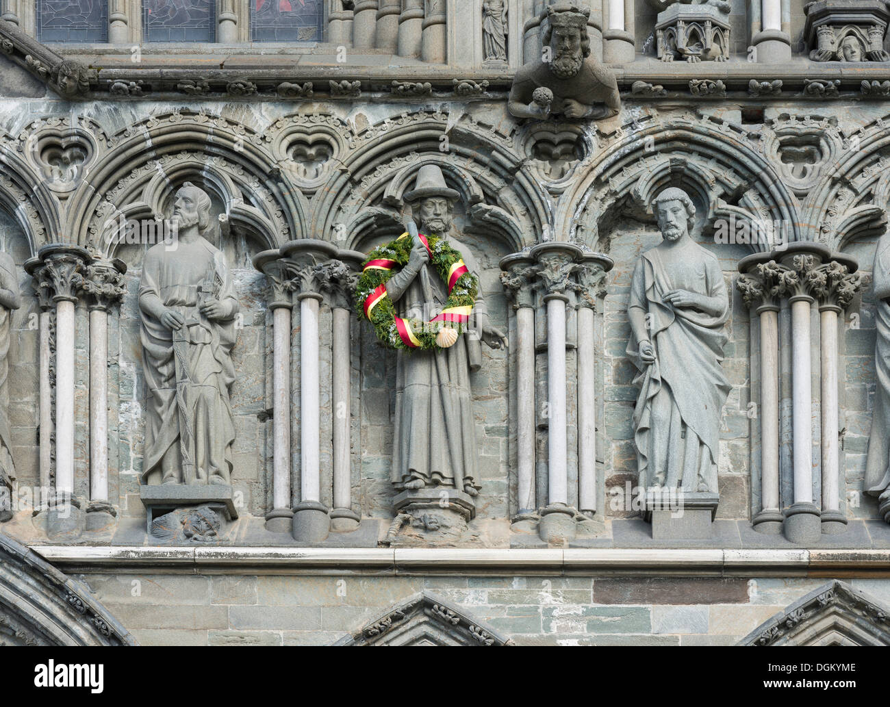 West facade on Nidaros Cathedral in Trondheim, detail with statues of saints, the apostle James the Greater is decorated with a Stock Photo
