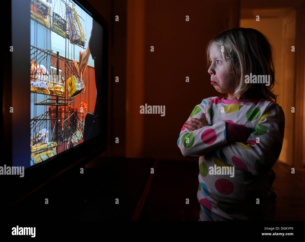 Little girl watching television Stock Photo Alamy