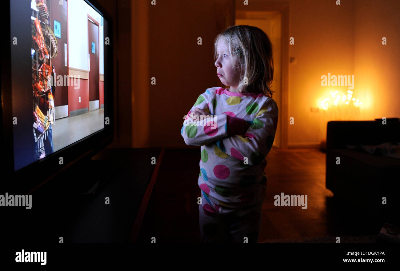 Little girl watching television Stock Photo Alamy