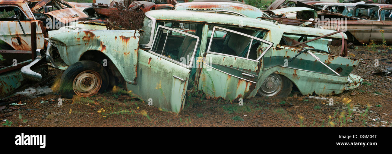 Old car in a scrap yard in the U.S Stock Photo Alamy