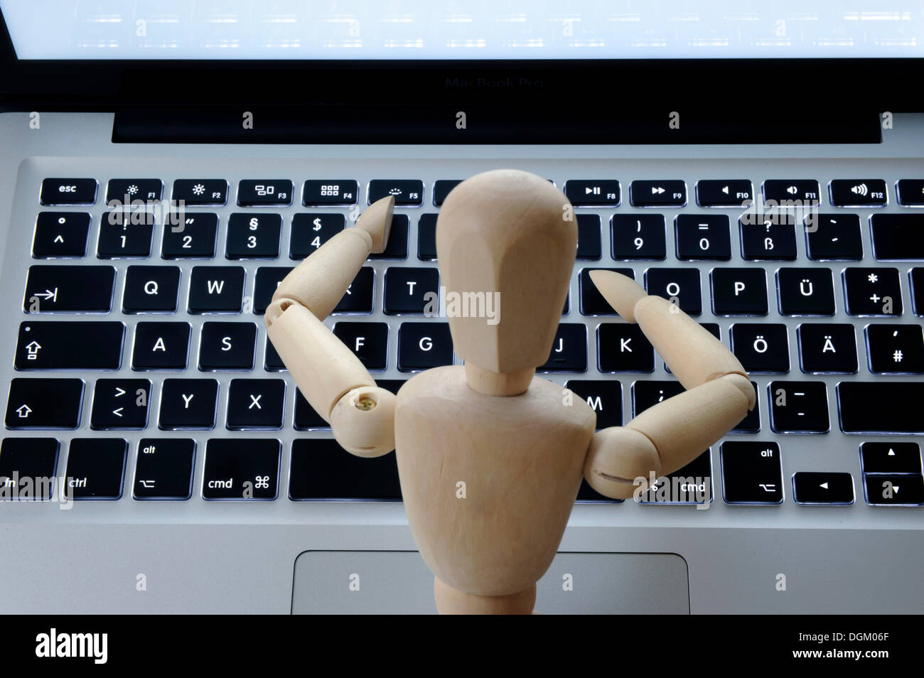 Mannequin at the keyboard, symbolic image for human beings and computers Stock Photo