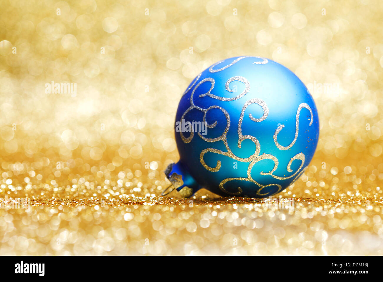 Decorative christmas ball close-up on golden background Stock Photo - Alamy