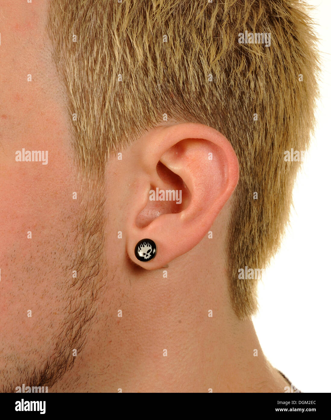 Detail, man, earring, skull motif Stock Photo