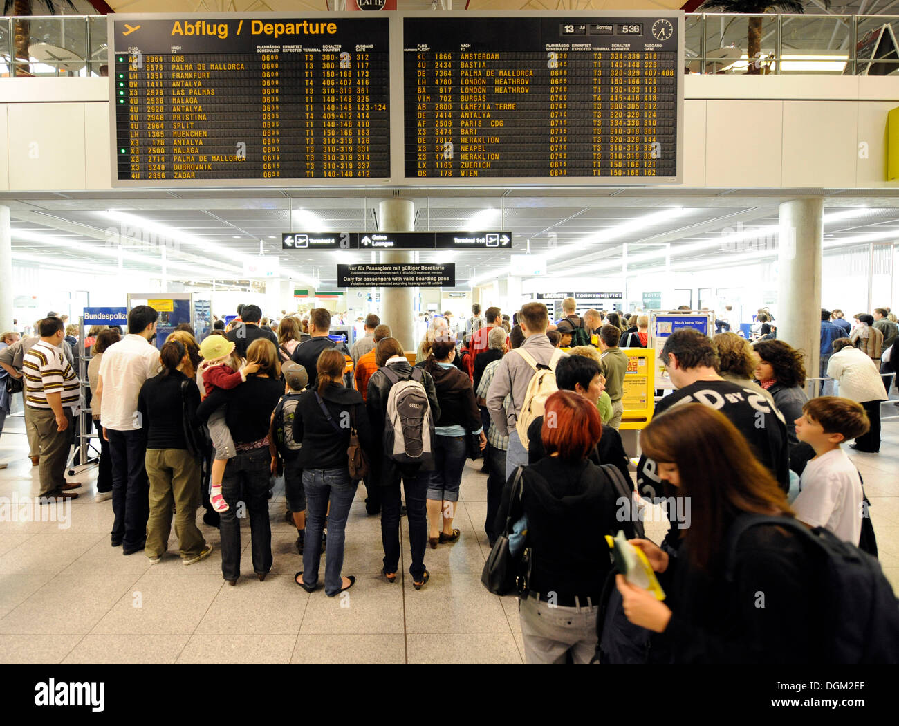 Passengers waiting in line at the check-in, departure board, Stuttgart  Airport, Baden-Wuerttemberg Stock Photo - Alamy