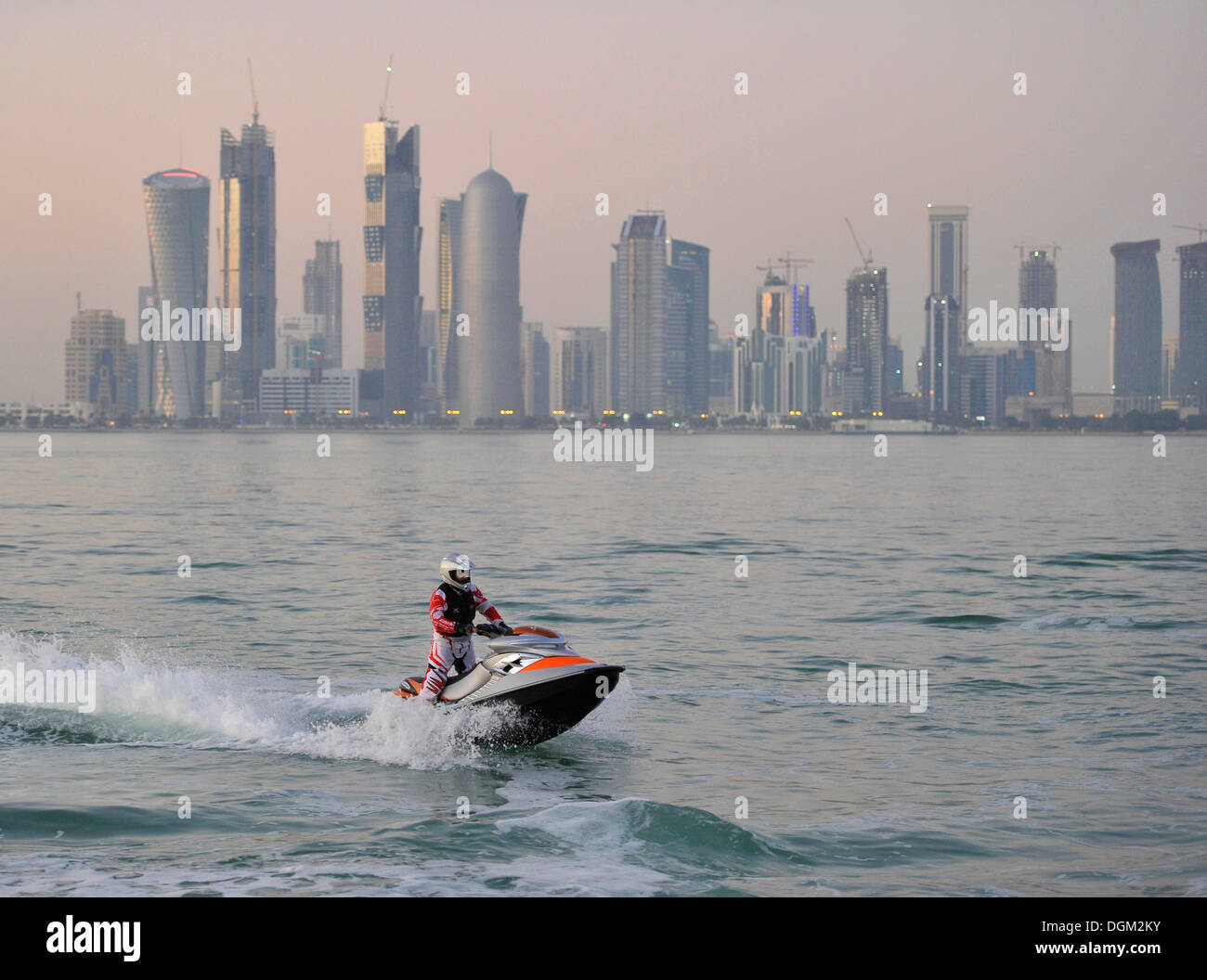Jet-skiing, jetboat, personal watercraft in front of the skyline of Doha, Qatar, Persian Gulf, Middle East, Asia Stock Photo