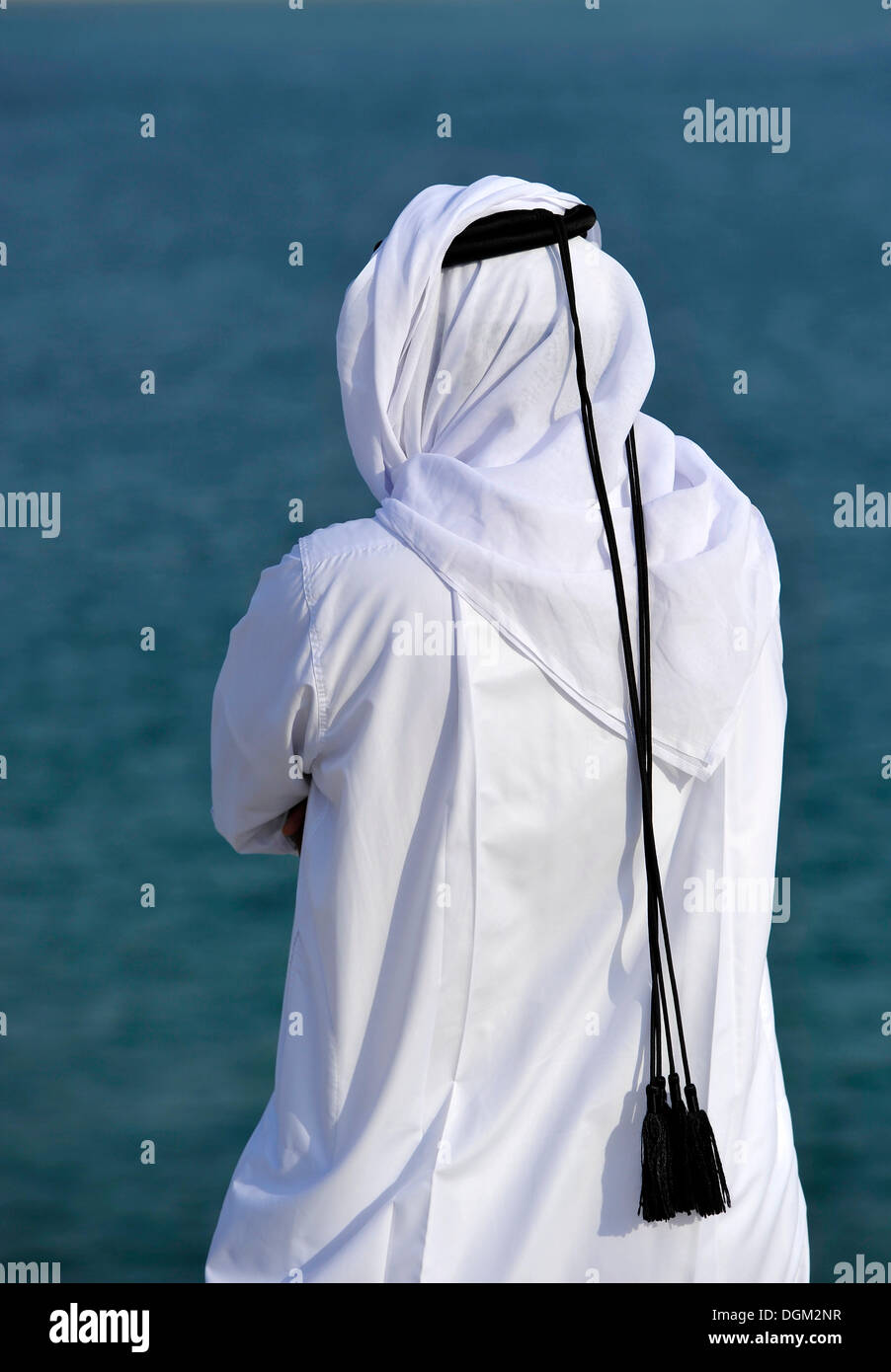 Qatari in traditional clothing with gutra, in front of Khor Al Udeid