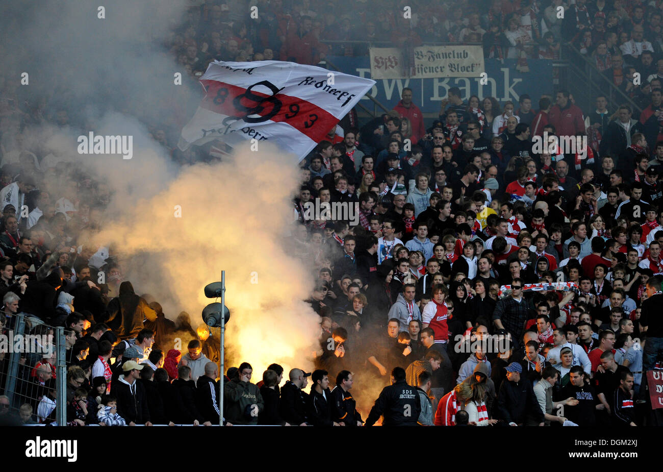 Vandalisers igniting fireworks, smoke bombs, flares, pyros, in the VfB Stuttgart fanblock, Mercedes-Benz Arena, Stuttgart Stock Photo