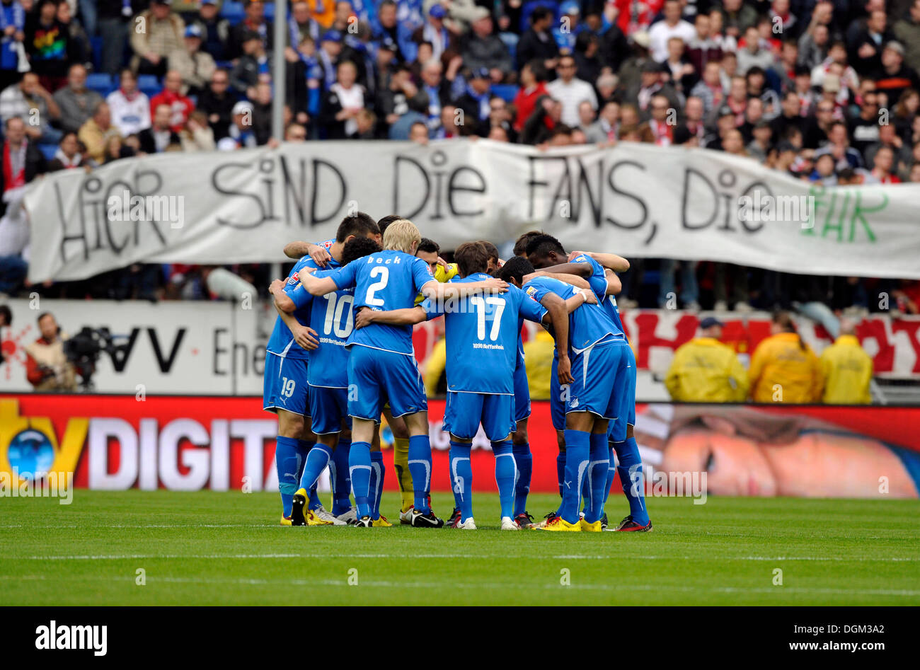 Football team of TSG Hoffenheim plucking up courage in front of the fan block, Rhein-Neckar-Arena, Sinsheim, Baden-Wuerttemberg Stock Photo