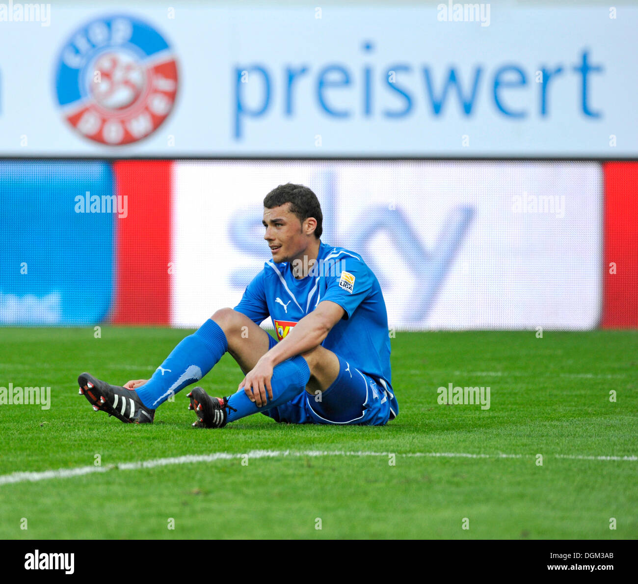 Manuel Guide of TSG 1899 Hoffenheim disappointed, sitting on the ground in front of an advertising board labelled 'preiswert', Stock Photo