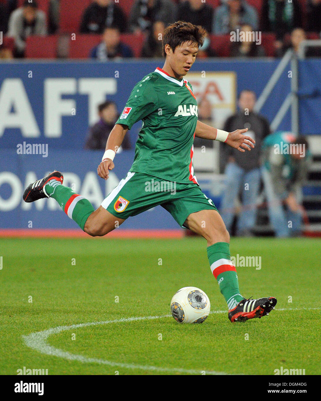 Augsburg, Germany. 20th Oct, 2013. Augsburg's Jeong-Ho Hong plays the ball during the German Bundesliga soccer match between FC Augsburg and VfL Wolfsburg at the SGL-Arena in Augsburg, Germany, 20 October 2013. Photo: STEFAN PUCHNER/dpa/Alamy Live News Stock Photo