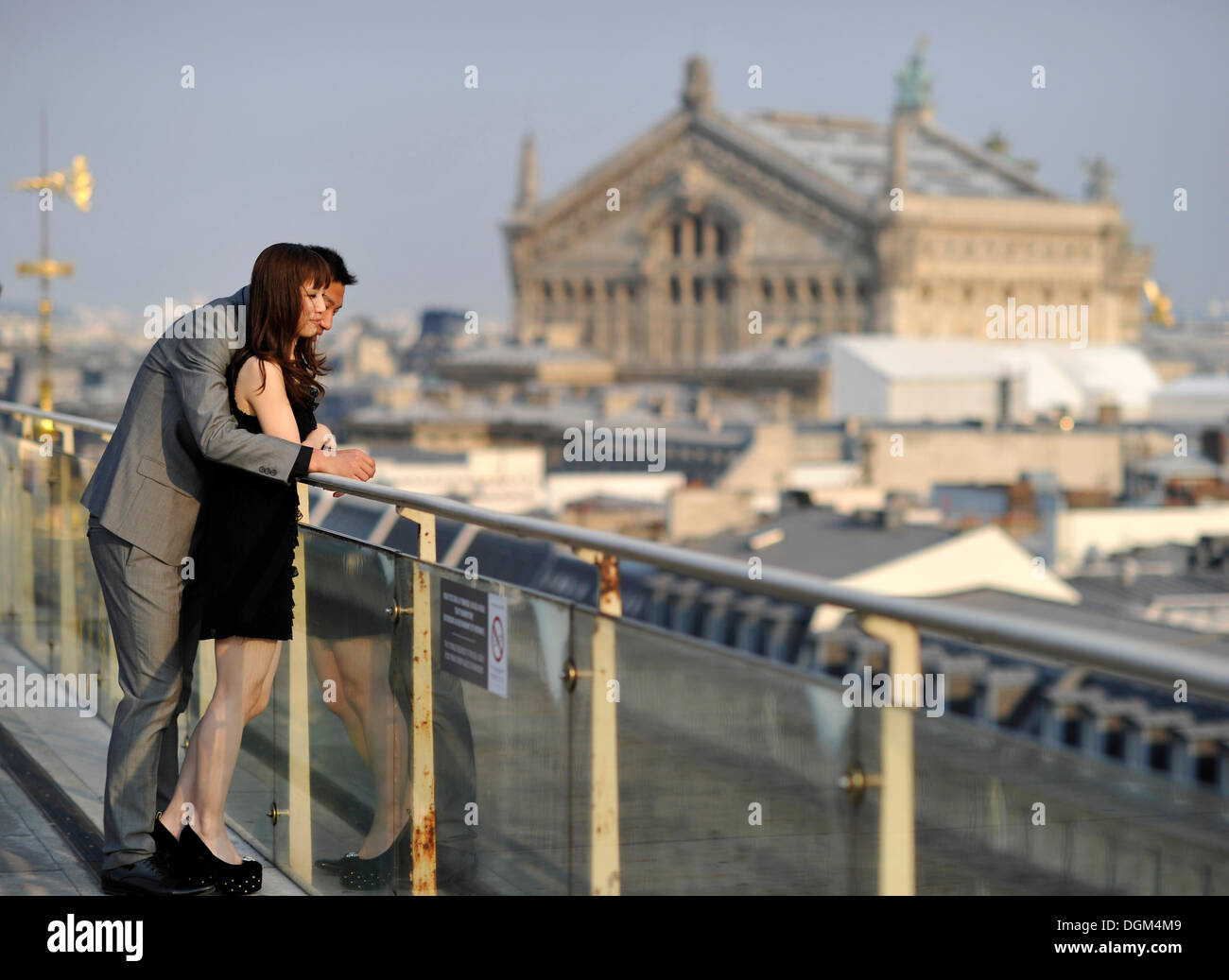 Couple and view from a viewing platform on the Opéra Palais Garnier opera house, Paris, France, Europe Stock Photo