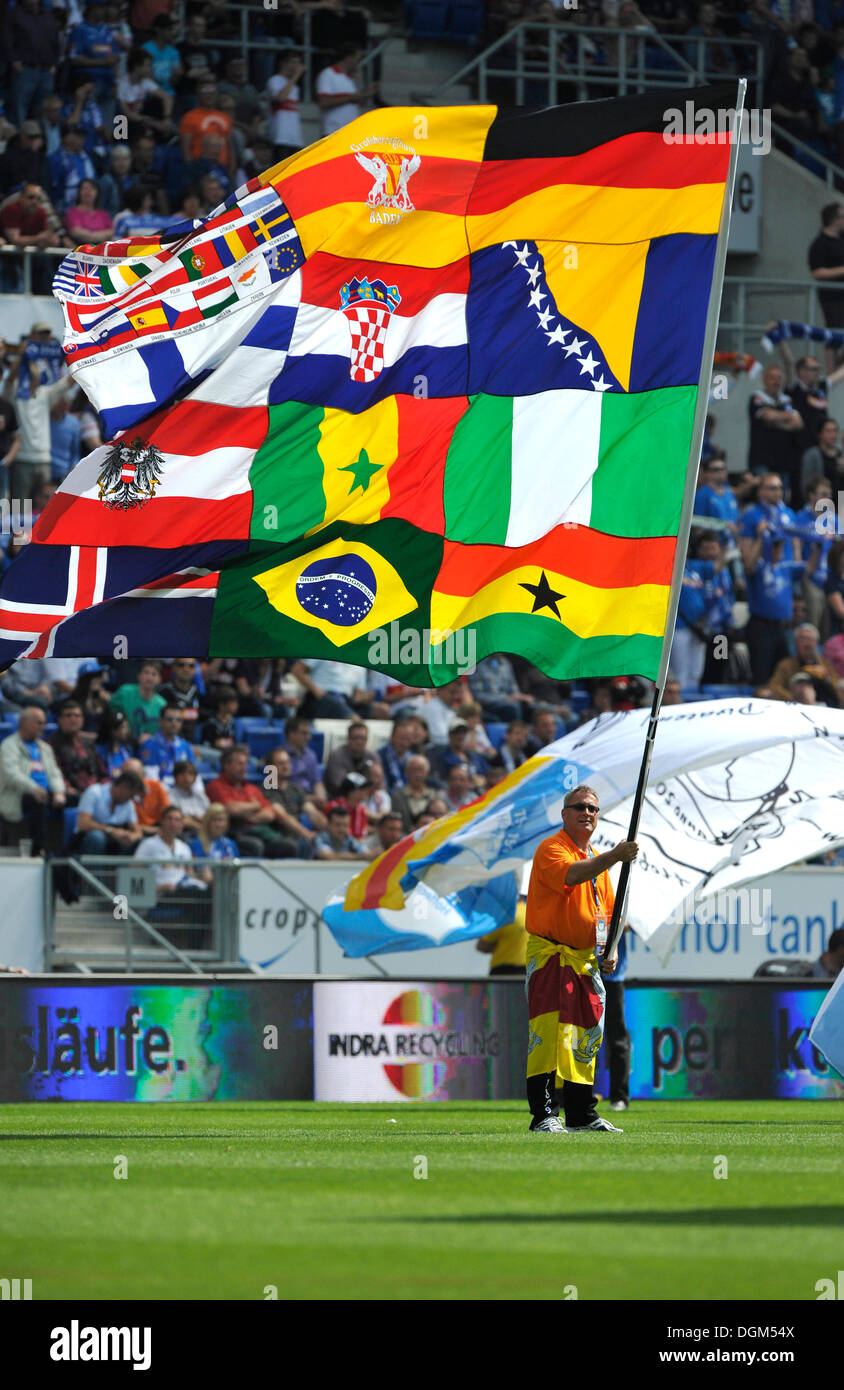Standard-bearer with various flags on a flag, Rhein-Neckar-Arena, Sinsheim Hoffenheim, Baden-Wuerttemberg Stock Photo