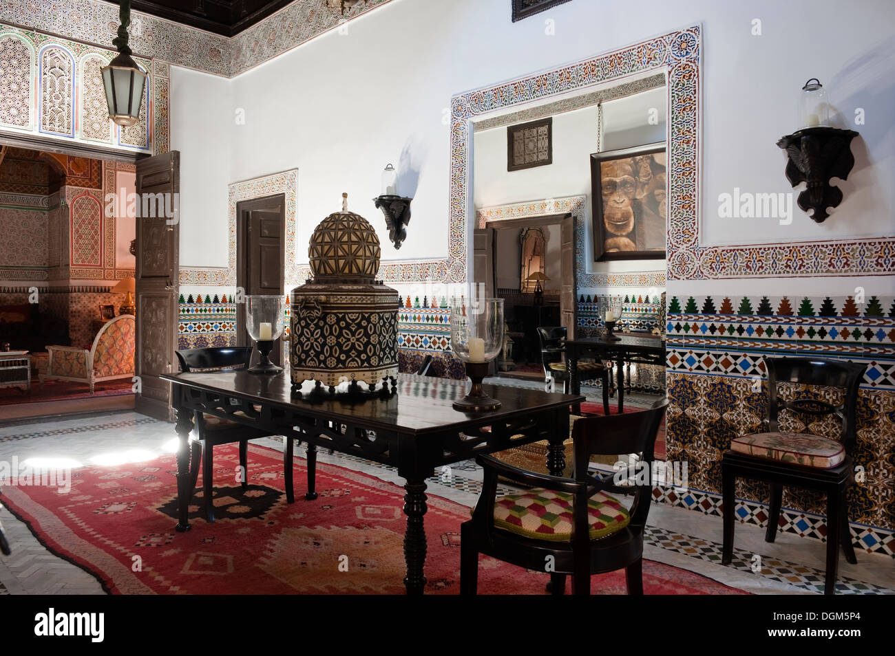 Stunning detailed Moroccan hallway with mosaic tiling and ironwork table lamp Stock Photo