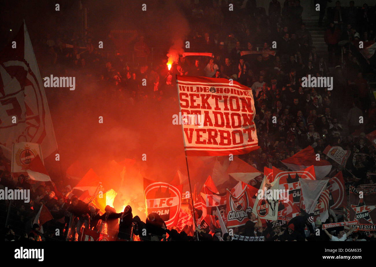 'Stadionverbot' written on banner, German for stadium ban, flares, pyrotechnics, bengal fireworks, Mercedes-Benz Arena Stock Photo