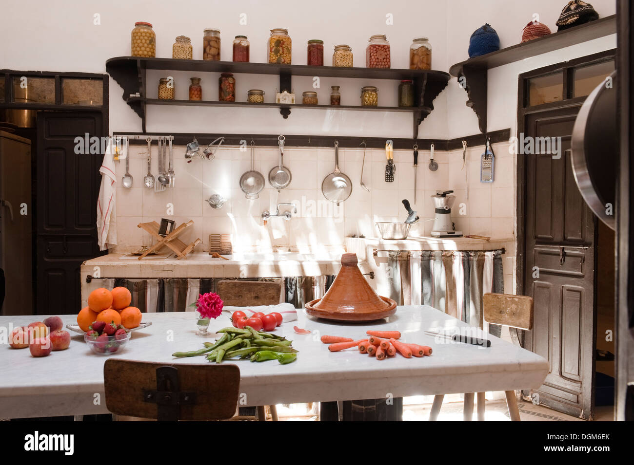 Moroccan kitchen with dark wood shelving Stock Photo