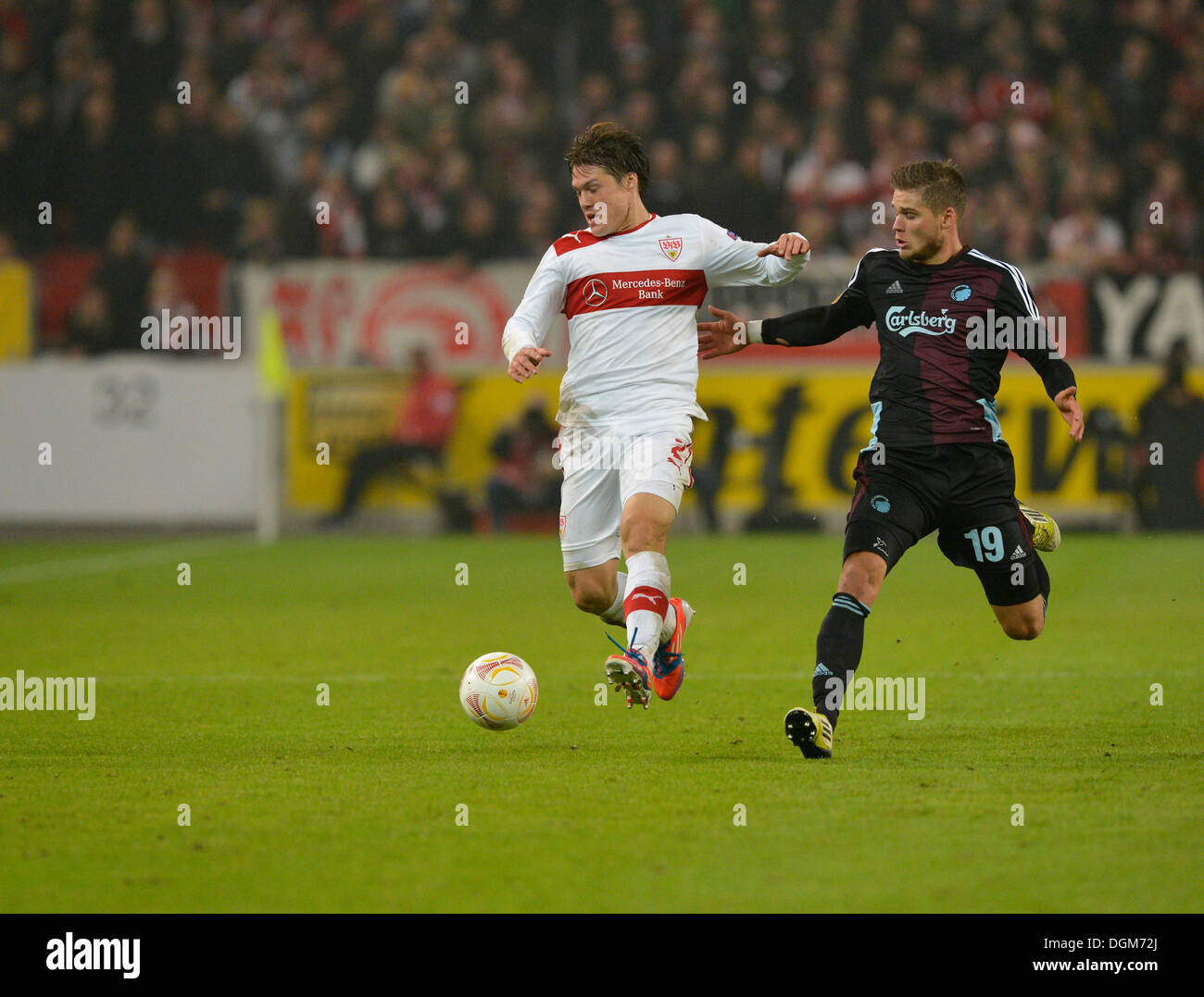 Duel between Gotoku Sakai, VfB Stuttgart, left, and Rurik Gislason, FC Copenhagen, right, Mercedes-Benz Arena, Stuttgart Stock Photo