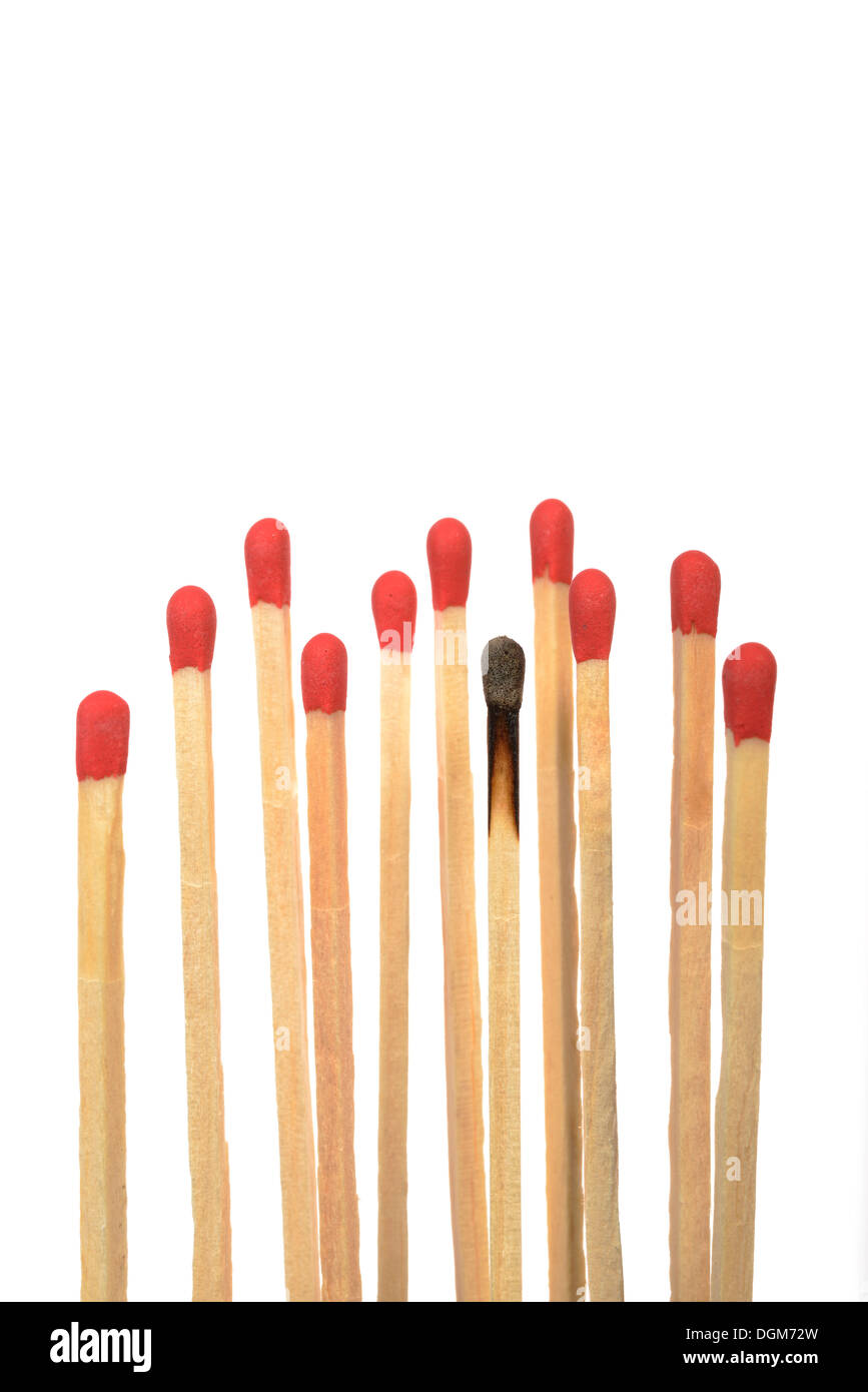 Matches with one burnt, symbolic image for burn-out, bullying or exclusion Stock Photo