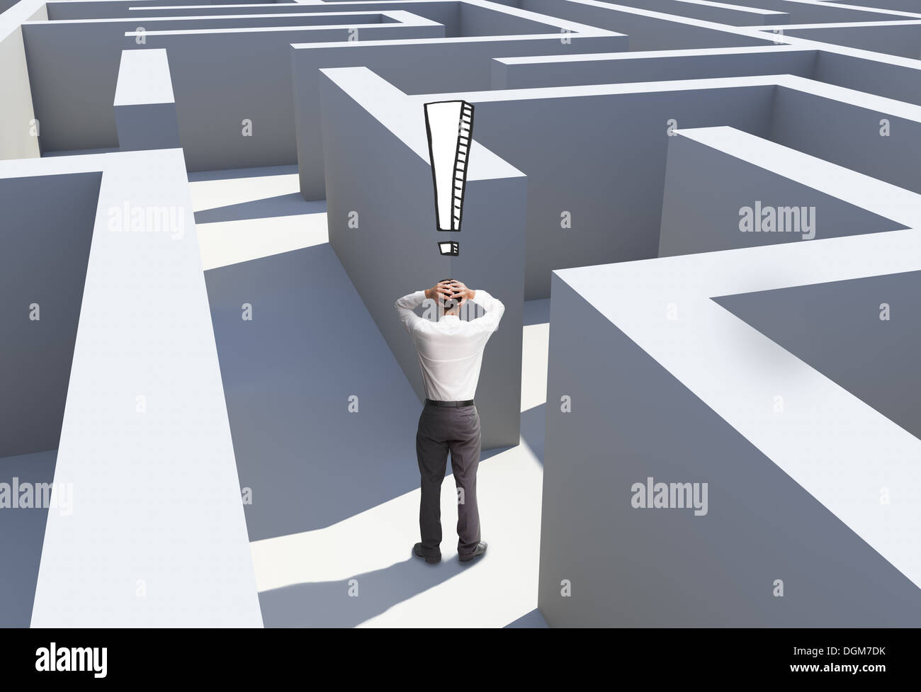 Rear view of desperate businessman standing in maze Stock Photo