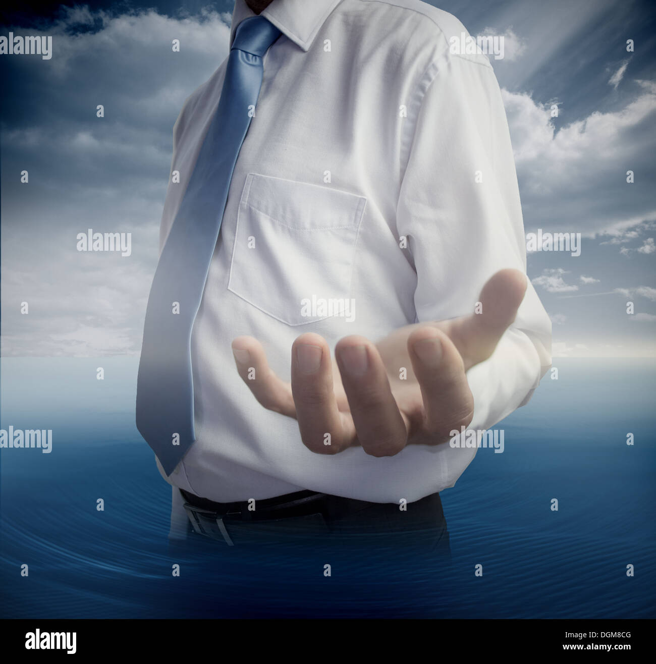 Mid section of man showing open hand Stock Photo