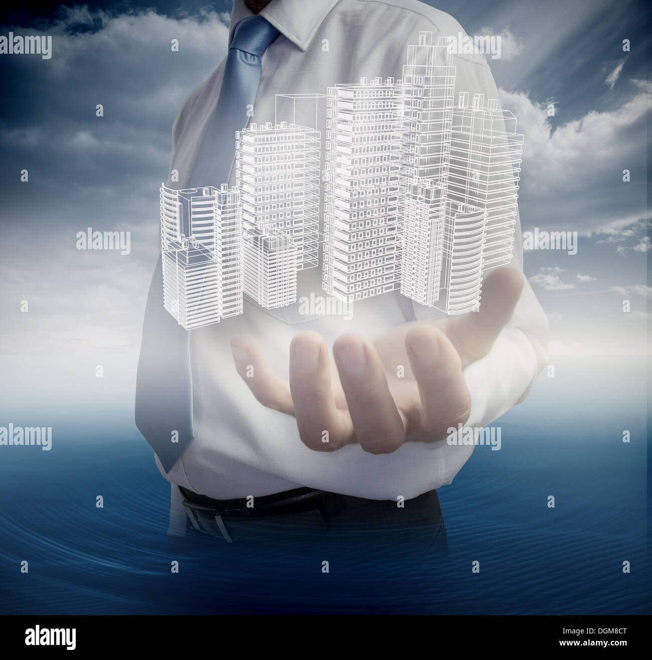 Close up of hand showing faint holographic city Stock Photo