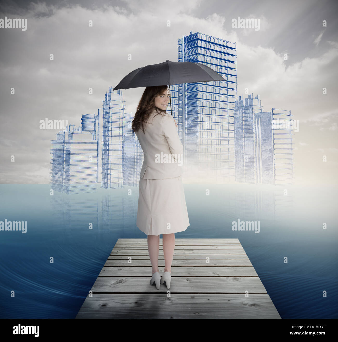 Rear view of businesswoman holding umbrella in front of holographic city Stock Photo